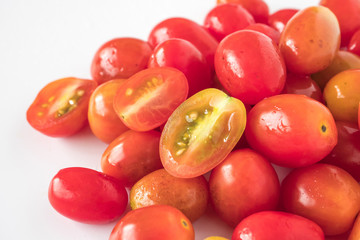 Close up of Fresh Plum tomatoes on white background.
