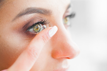 Health and Beauty. Beautiful Young Girl With Green Eyes Holds Contact Lens On Finger. Eye Care....
