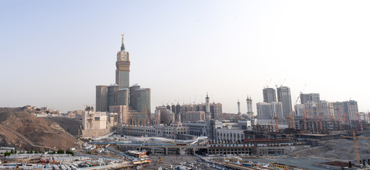 MECCA, SAUDI ARABIA - MAY 07 2018: Amazing panoramic view from a rock on the Abraj Clock Tower and skyscrapers complex, Masjid Al Haram or Grand Mosque is also visible on right side. Best for print