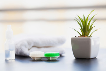 Vision And Medicine Concept. Accessories for contact lenses: contact lens case, tweezers, solution
