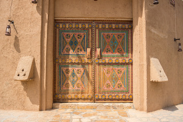 Authentic Arabian style wooden door with decoration pattern in Riyadh, Saudi Arabia - obrazy, fototapety, plakaty