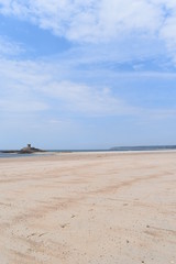Fototapeta na wymiar Beach at low tide, Jersey, Channel Islands, UK, Europe, July 2018