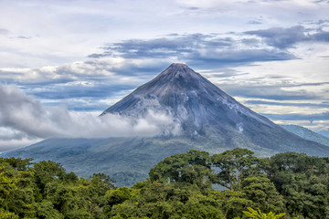 Fototapeta premium Arenal Volcano with Clouds and Jungle