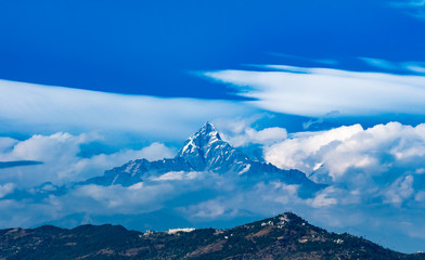 The Himalayas in Nepal shrouded in clouds. 