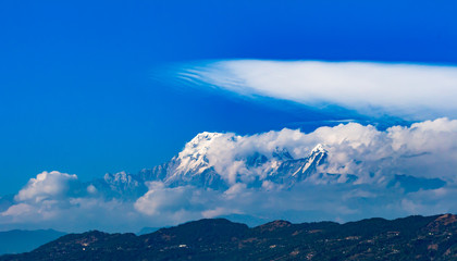 The Himalayas in Nepal shrouded in clouds. 