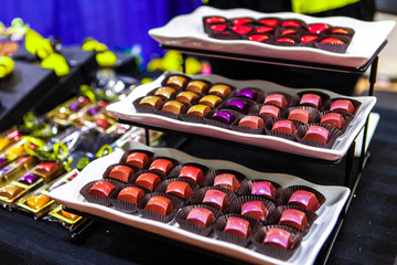 Colorful chocolate display pictured in an indoors farmer's market