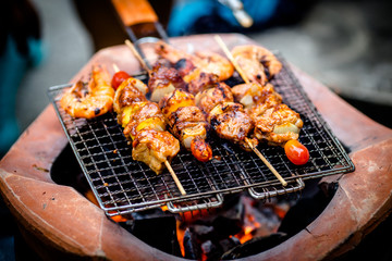 Barbecue grill with various kinds of meat, close-up.