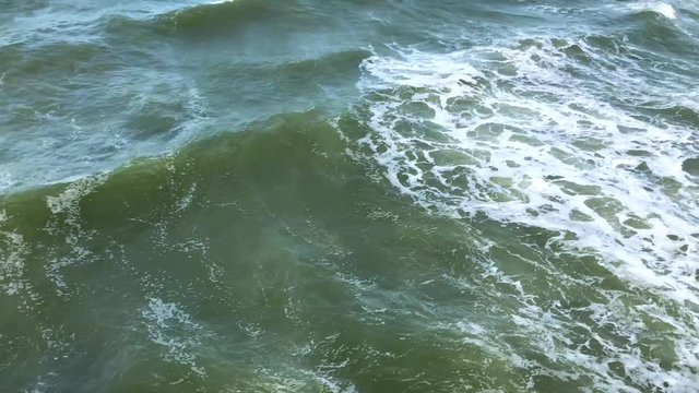 Set of two 30 second clips of waves crashing. Shot from above the water. Slightly colorgraded.