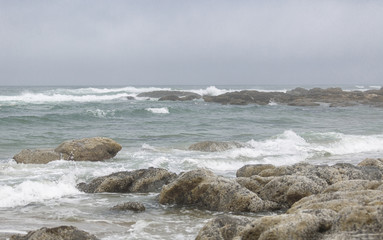 Fototapeta na wymiar Oregon coast, rocks on beach. Before rain.
