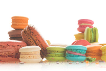 Mixed size of french macarons on white background