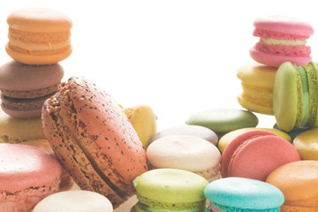 Mixed size of french macarons on white background