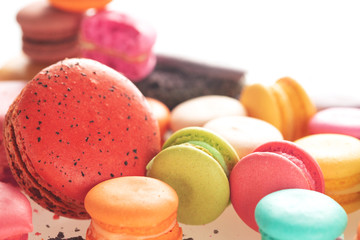 Mixed size of french macarons on white background