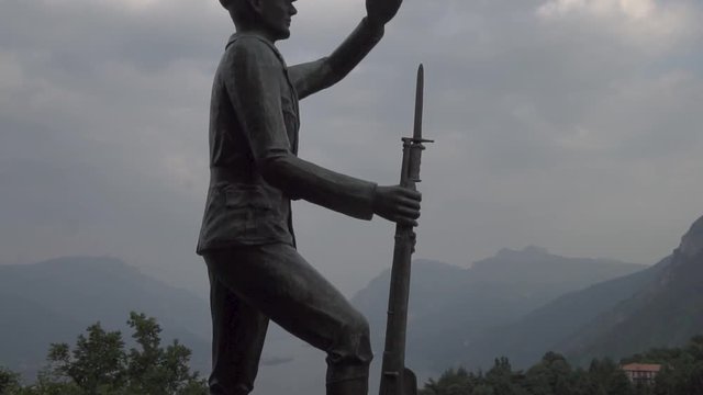 a statue in memory of dead soldiers in civenna como lake