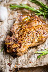 Grilled meat on the rustic background. Selective focus. Shallow depth of field.