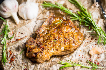 Grilled meat on the rustic background. Selective focus. Shallow depth of field.
