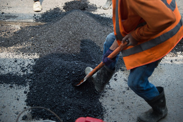 Roadman is wearing asphalt