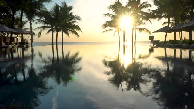 Pool by the beach in the morning with floating unicorn