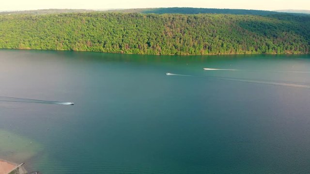 View from above of couple boats passing by on the Lake