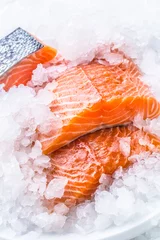 Fotobehang Close-up Fresh raw salmon fillets on Ice © weyo