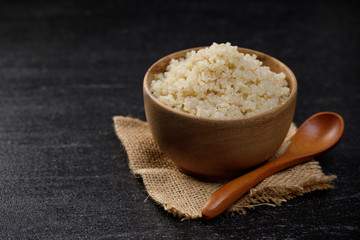 Obraz na płótnie Canvas Healthy quinoa in the wooden bowl, Healthy food habits and concept of balanced diet