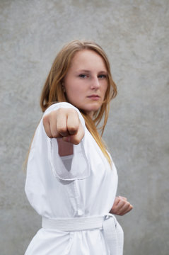 young woman is practising taekwondo martial arts