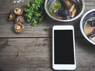 Smart phone and black chicken soup