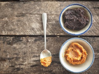 Miso paste on wood background