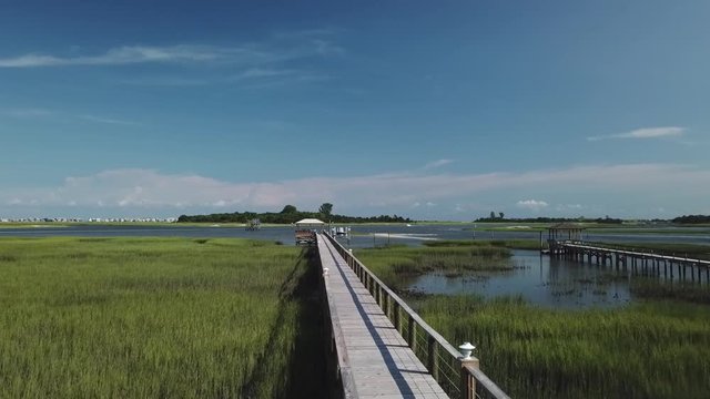Long Pier with boat dock on the end on the intercostal waterway near Wrightsville Beach.
