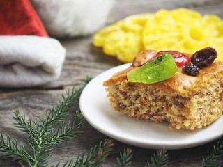 Fruits cake and christmas hat