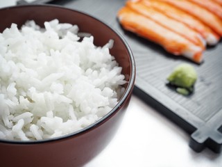 Crab sticks and rice isolated white background