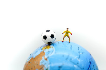 Miniature people : Soccer player man,football world championship cup concept.