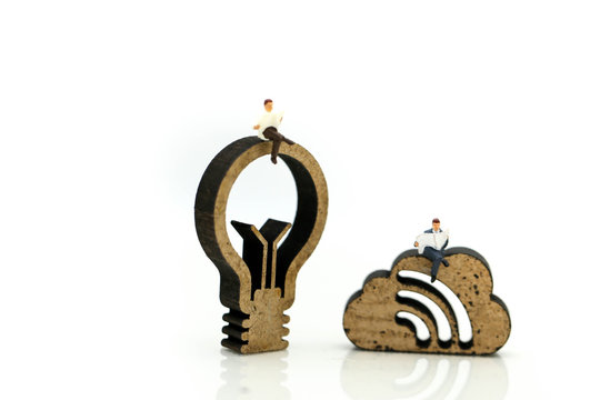 Miniature people : reading a book with sign of lamp idea and world map,Education business concept.