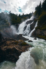 Rutor Waterfall in forest of Valle D'Aosta