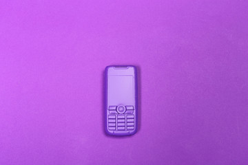 phone lying on colorful background, top view.