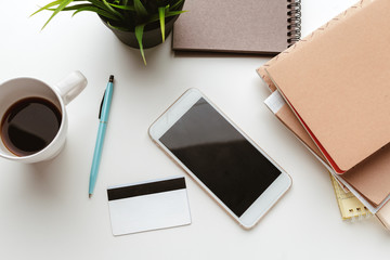 Business Items dropped in creative Disorder on white Table