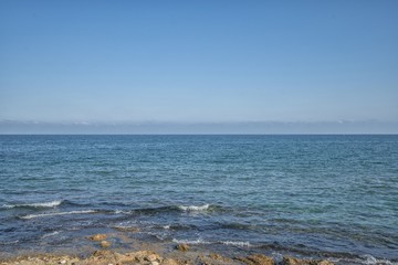 Coast of mediterranean sea with the sky and waves.