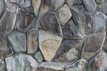 Fragment of a stone fence fixed by a close-up photo shooting