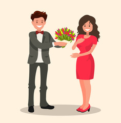 Man dressed in a suit gives a woman a bouquet of flowers and a gift.