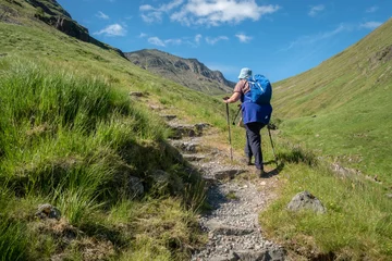 Foto auf Acrylglas Female hill walker in Glencoe, Scottish Highlands © RamblingTog