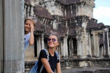 Happy smiling mother and son together visiting Angkor, Cambodia