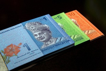 Malaysia Currency (MYR): Stack of Ringgit Malaysia bank note. There are one, five and ten Ringgit Malaysia