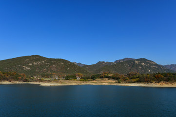 Fototapeta na wymiar A big lake surrounded by mountains in Korea.
