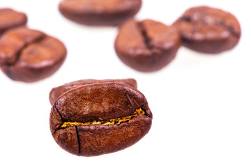 Brown coffee beans isolated on white background
