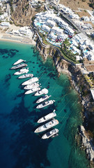 Aerial drone photo of luxury speed boats docked in popular beach of Psarou with iconic resorts,...