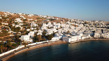 Fototapeta na wymiar Aerial photo of iconic and traditional whitewashed old port of Mykonos island at sunset, Cyclades, Greece