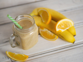 A banana orange smoothie. Healthy milkshake