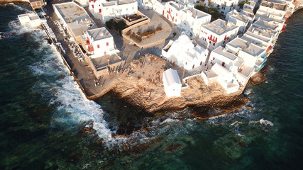 Fototapeta na wymiar Aerial photo from iconic Paraportiani church in little Venice at sunset, old port of Mykonos island, Cyclades, Greece