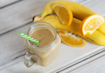A banana orange smoothie. Healthy milkshake