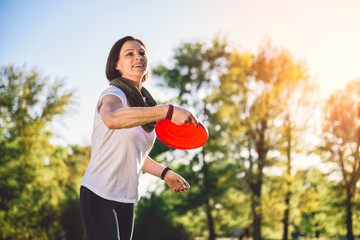 Woman throwing flying disk