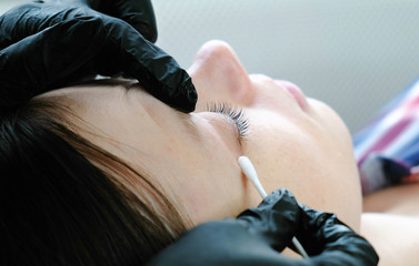 Closeup woman's lashes after procedure of lash lamination. Beauty treatment. Closeup eye.